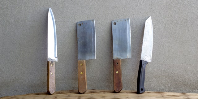 knife cooking set still life on mat weave and concrete wall