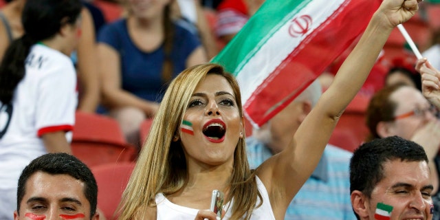 An Iran fan cheers before the start of their Asian Cup Group C soccer match against UAE at the Brisbane Stadium in Brisbane January 19, 2015. REUTERS/Edgar Su (AUSTRALIA - Tags: SOCCER SPORT)