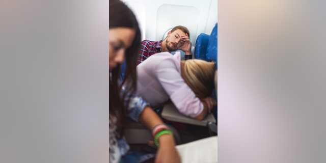 An airline passenger (not pictured) chided a tall man on board a flight for not picking a seat in the aisle or paying extra for additional legroom — and shared what happened after that in his Reddit post.