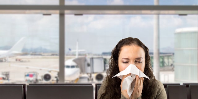 sneezing woman sick blowing nose with white background