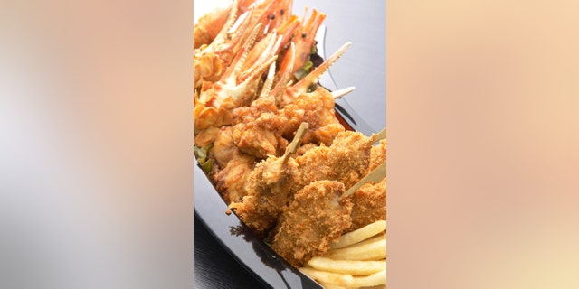Kushikatsu, deep-fried meat and vegetable skewers, are a very popular street food in Japan.