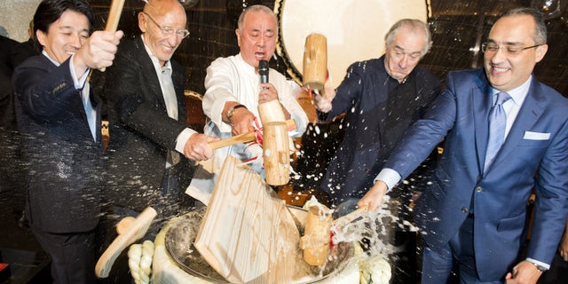 A traditional sake ceremony at the opening of De Niro's new Nobu restaurant.