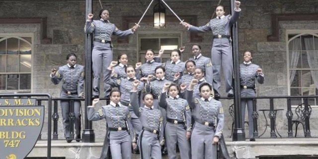 FILE- This undated file image obtained from Twitter on Saturday, May 7, 2016 shows 16 black, female cadets in uniform with their fists raised while posing for a photograph at the United States Military Academy at West Point, N.Y.