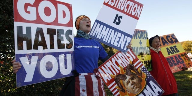Nov. 11, 2010: Members of the Westboro Baptist Church hold anti-gay signs at Arlington National Cemetery in Virginia on Veterans Day.