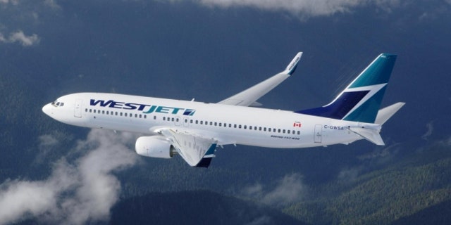 WestJet announced last month that its zero-tolerance facade policy would go into effect on 1 September. (AP)