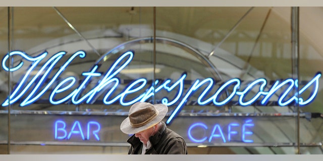 FILE PHOTO: A Wetherspoon's logo is seen at a bar in central London March 13, 2009. (REUTERS/Toby Melville//File Photo)