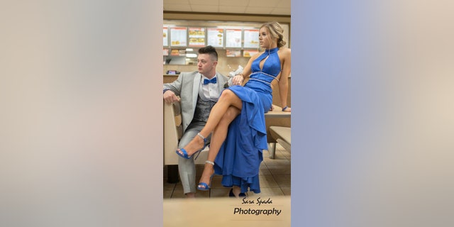Hefner wore a cerulean blue gown with cutouts and glitter accents, while Henry opted for a light gray tuxedo with a blue bow tie and velvet smoking slippers.