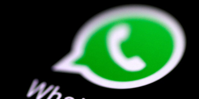 File photo: The WhatsApp messaging application is seen on a phone screen. (REUTERS/Thomas White)