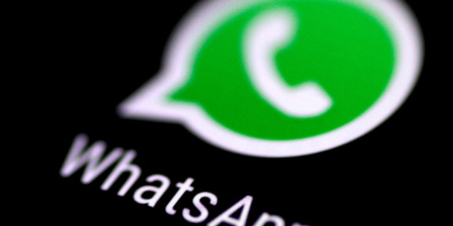 File photo: The WhatsApp messaging application is seen on a phone screen. (REUTERS/Thomas White)