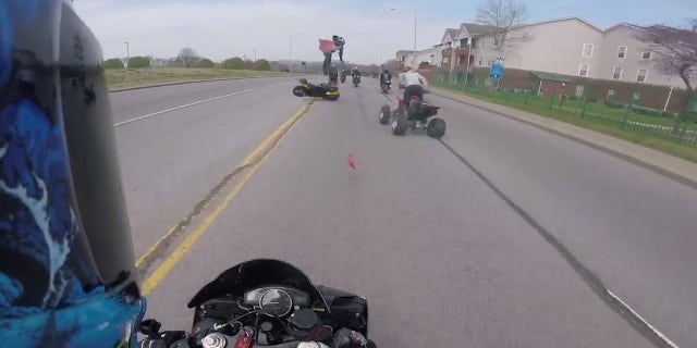 Sewell's motorcyle rode over the rear tire of the ATV and was launched a good 10 feet in the air.