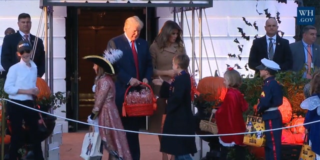 The girl, seen at left, wore a hat emblazoned with "FLOTUS," or First Lady of the United States.
