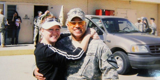 Sept. 22, 2014: Omar Gonzalez poses for a photo in his Army uniform with his former wife Samantha, prior to an overseas deployment.