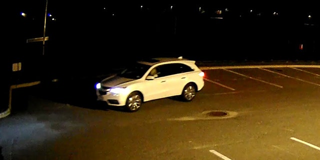 Nassau County police said a woman driving a white Acura MDX was seen fleeing from a Long Island high school after it was tagged with profane graffiti.
