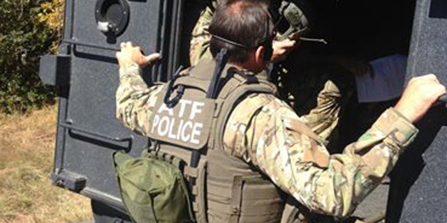 Oct. 14, 2013: Agents executing a search warrant at the home of Kirby Kehoe near Ash Fork, Ariz.