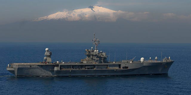Mar. 25, 2011: U.S. Sixth Fleet's flagship USS Mount Whitney (LCC/JCC 20) steams by Mount Etna in support of Joint Task Force (JTF) Odyssey Dawn in the Mediterranean Sea.