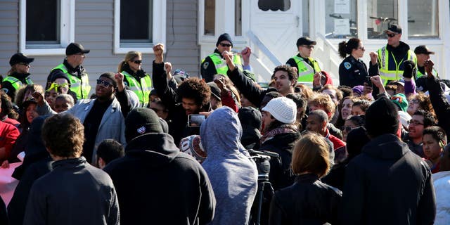 March 7, 2015: People gather during a rally protesting the shooting death of Tony Robinson.