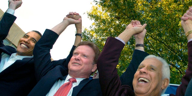 Then-Sen. Barack Obama, D-Ill., Sy. Jim Webb, D-Go., and then-Richmond Mayor Douglas Wilder join hands at a campaign rally at Virginia Union University in Richmond, November 2, 2006. REUTERS/Jonathan Ernst