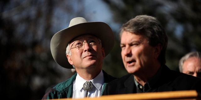 Secretary of the Interior Ken Salazar watches geese fly overhead as Bureau of Land Management Director Bob Abbey speaks about an initiative that would allow the BLM to designate and protect wilderness areas on Thursday, Dec. 23, 2010 outside of REI in Denver. (AP)