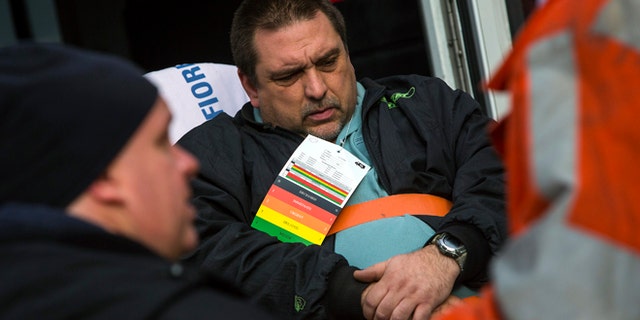 Dec. 1, 2013: Metro-North engineer William Rockefeller is loaded into an ambulance after a train derailment in the Bronx borough of New York.