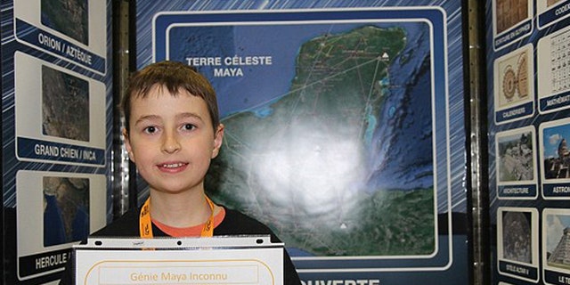 This undated photo shows William Gadoury presenting a school science fair project on Mayan cities
