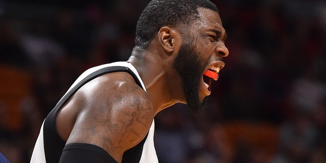 Miami Heat forward Willie Reed reacts after scoring.