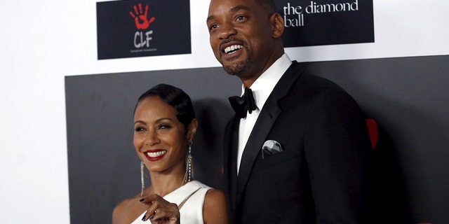 Actor Will Smith and his wife, actress Jada Pinkett Smith pose at the second annual Diamond Ball fundraising event in Santa Monica, California December 10, 2015. REUTERS/Mario Anzuoni - GF10000262061