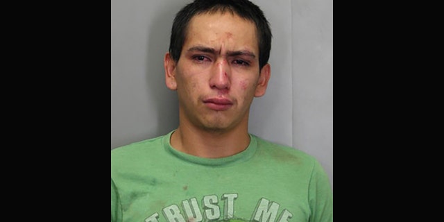 Wilmer Garcia, is accused of stealing a car while wearing a "Trust Me" t-shirt.