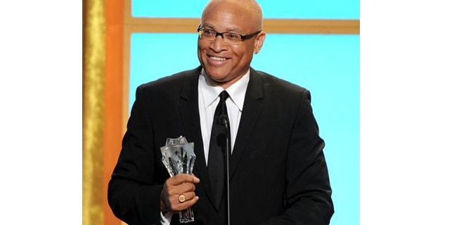 FILE: June 10, 2013: Larry Wilmore accepts the best talk show award for "The Daily Show with Jon Stewart" at the Critics' Choice Television Awards in the Beverly Hilton Hotel in Beverly Hills, Calif.