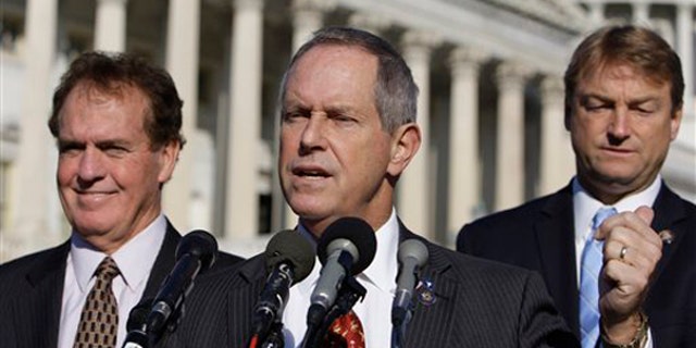 Rep. Joe Wilson, R-S.C., center, speaks about health care reform Nov. 4 in Washington, by Rep. Phil Gingrey, R-Ga., right, and Rep. Dean Heller, R-Nev. (AP Photo)