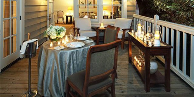 This photo courtesy of Meadowood Napa Valley shows the Meadowood Club Suite deck in St. Helena, Calif. The exclusive Meadowood resort offers a "We Hope Youll Elope" package. They provide the candles, decorations, bouquet and boutonniere, non-denominational wedding officiate, al fresco dinner for two including wine and breakfast. (AP Photo/Meadowood Napa Valley)