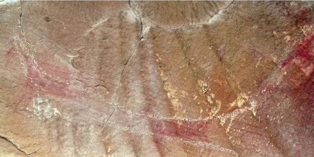 A close-up view of the other "wing." Notice the white chalk lines that were added in the 1940s, and may have been re-chalked since then. Researchers originally used chalk to help visualize the rock art, but the practice is now illegal.