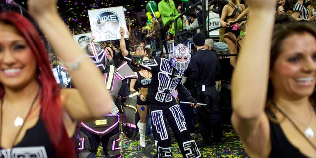 Jan. 30, 2015: Cheerleaders and characters supporting contestants parade through the Wells Fargo Center before the 23rd annual Wing Bowl in Philadelphia.