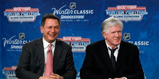 Feb. 9, 2012: Detroit Red Wings general manager Ken Holland, left, and Toronto Maple Leafs President &amp; General Manager Brian Burke speak at a news conference to announce the NHL Winter Classic hockey game at Comerica Park in Detroit. The Toronto Maple Leafs will play the Detroit Red Wings at Michigan Stadium in Ann Arbor, Mich., on Jan. 1, 2013.