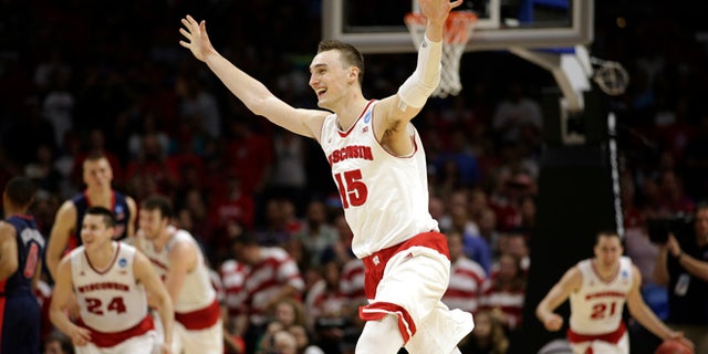 Mar. 28, 2015: Wisconsin forward Sam Dekker (15) celebrates after Wisconsin beat Arizona 85-78 in a college basketball regional final in the NCAA Tournament in Los Angeles. (AP)