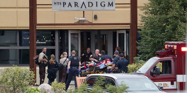 Emergency personnel arrive on the scene of a shooting at a software company in Middleton, Wis., Wednesday, Sept. 19, 2018.