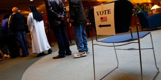 Nov. 6, 2012: People stand in line to vote during the U.S. presidential election in Janesville, Wisconsin.