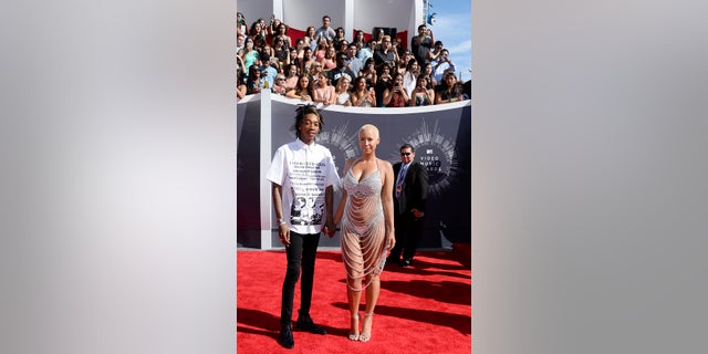 Wiz Khalifa and Amber Rose arrive at the 2014 MTV Music Video Awards in Inglewood, California August 24, 2014. REUTERS/Kevork Djansezian (UNITED STATES - Tags: ENTERTAINMENT)(MTV-ARRIVALS) - RTR43K9D