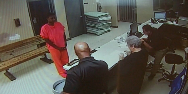 FILE - In this undated file image made from video provided by the Waller County Sheriff's Department, Sandra Bland stands before a desk at Waller County Jail in Hempstead, Texas. The small-town Texas jail where Sandra Bland died last summer needs to be replaced, and its jailers need body cameras and anger-management training, according to a report issued Tuesday, April 12, 2016 by a panel convened after Bland's death. (Waller County Sheriff's Department via AP, File)