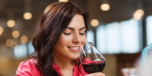 woman drinking wine istock