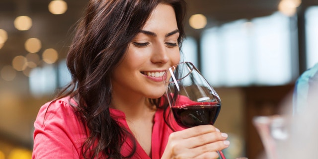 woman drinking wine istock