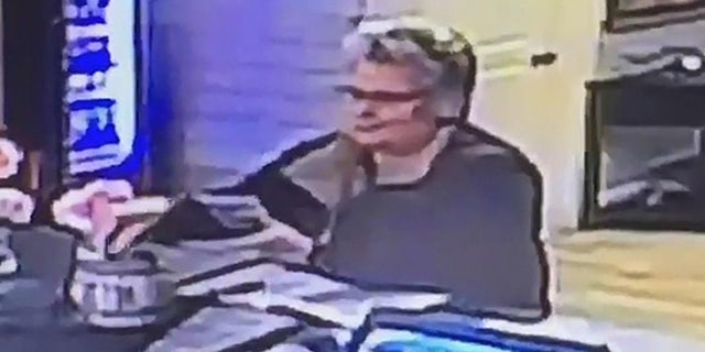 The police are looking for a woman accused of stealing about $20 from a tip jar at a Massachusetts seafood restaurant.