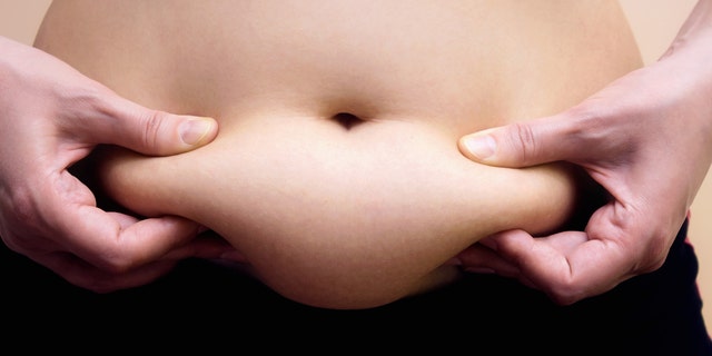 woman with belly fat istock