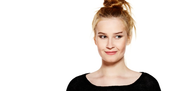 Portrait of attractive young woman isolated on white background.
