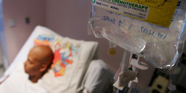 SAN FRANCISCO - AUGUST 18: Eighteen-year-old cancer patient Patrick McGill lies in his hospital bed while receiving IV chemotherapy treatment for a rare form of cancer at the UCSF Comprehensive Cancer Center Childrens Hospital August 18, 2005 in San Francisco, California. The UCSF Comprehensive Cancer Center continues to use the latest research and technology to battle cancer and was recently rated 16th best cancer center in the nation by US News and World Report. (Photo by Justin Sullivan/Getty Images)