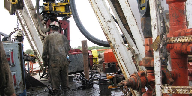 Oct. 19, 2013: Apache Corp worker drills a horizontal well in the Wolfcamp Shale in west Texas’ Permian Basin.