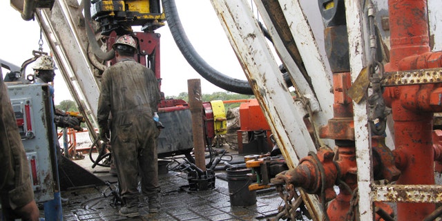 Oct. 19, 2013: Apache Corp worker drills a horizontal well in the Wolfcamp Shale in west Texas’ Permian Basin.