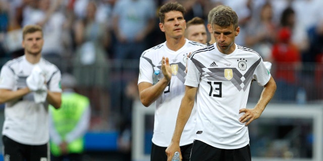 Germany's Thomas Mueller, right, reacts at the end of the group F match between Germany and Mexico at the 2018 soccer World Cup in the Luzhniki Stadium in Moscow, Russia, Sunday, June 17, 2018.
