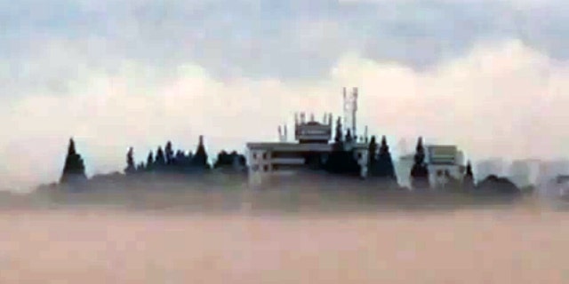 Tall buildings miraculously appeared on the normally clear Xin'an River.