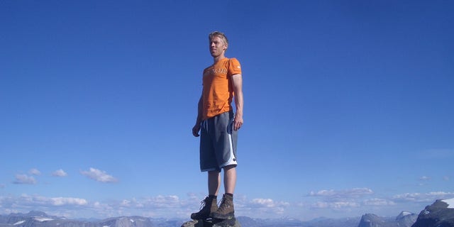 Climbing to the top of a mountain in his native Norway.