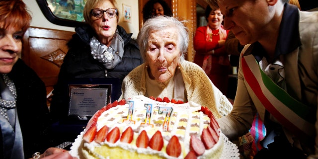 Emma Morano, thought to be the world's oldest person and the last to be born in the 1800s, blows candles during her 117th birthday in Verbania, northern Italy Nov. 29, 2011.